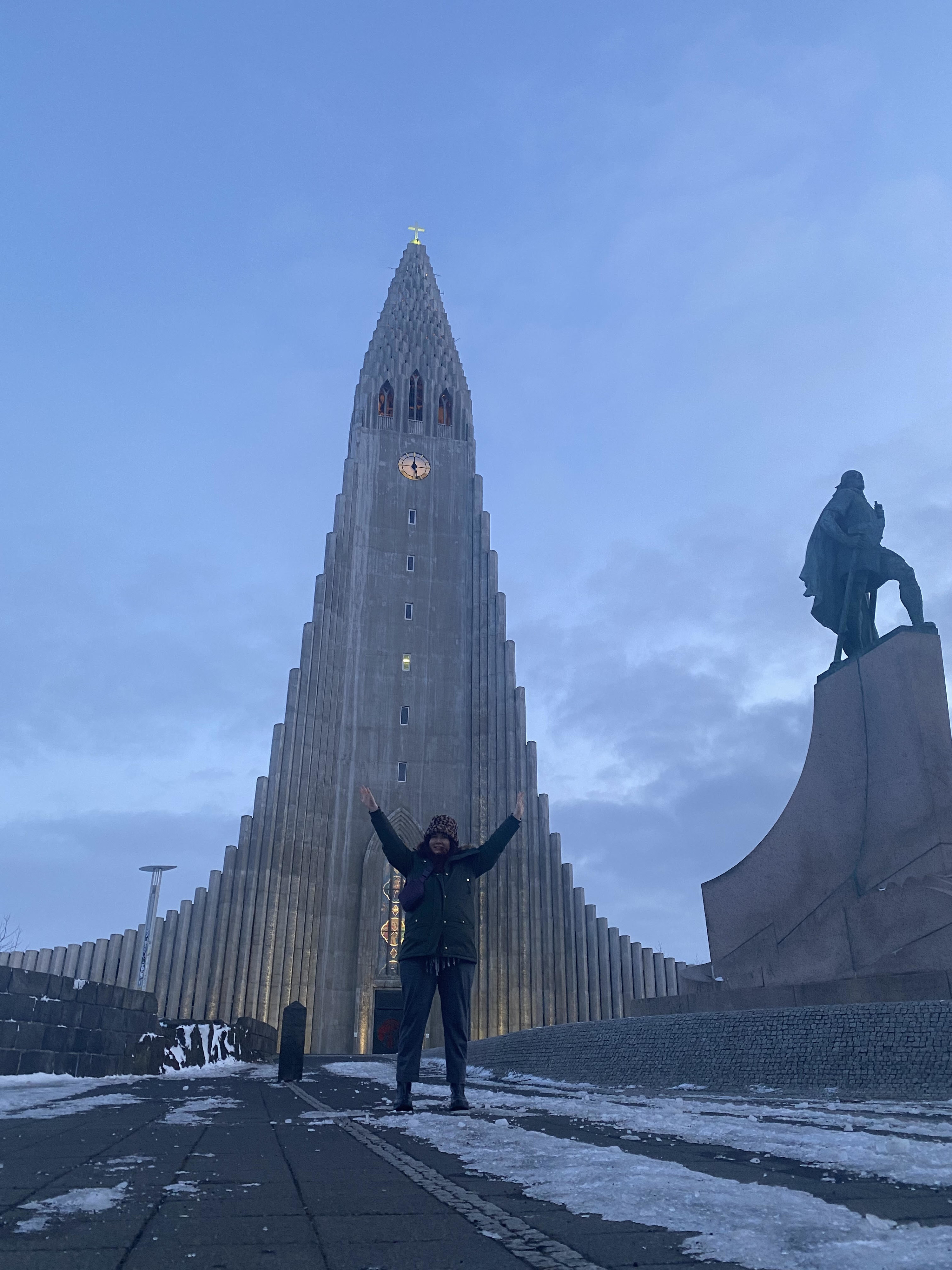 writer in front of a church in Iceland while wearing the pants