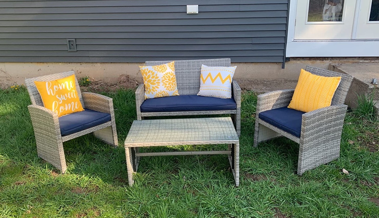 A furniture set is shown on some grass