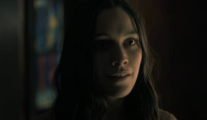 Close-up of woman in a darkly lit room