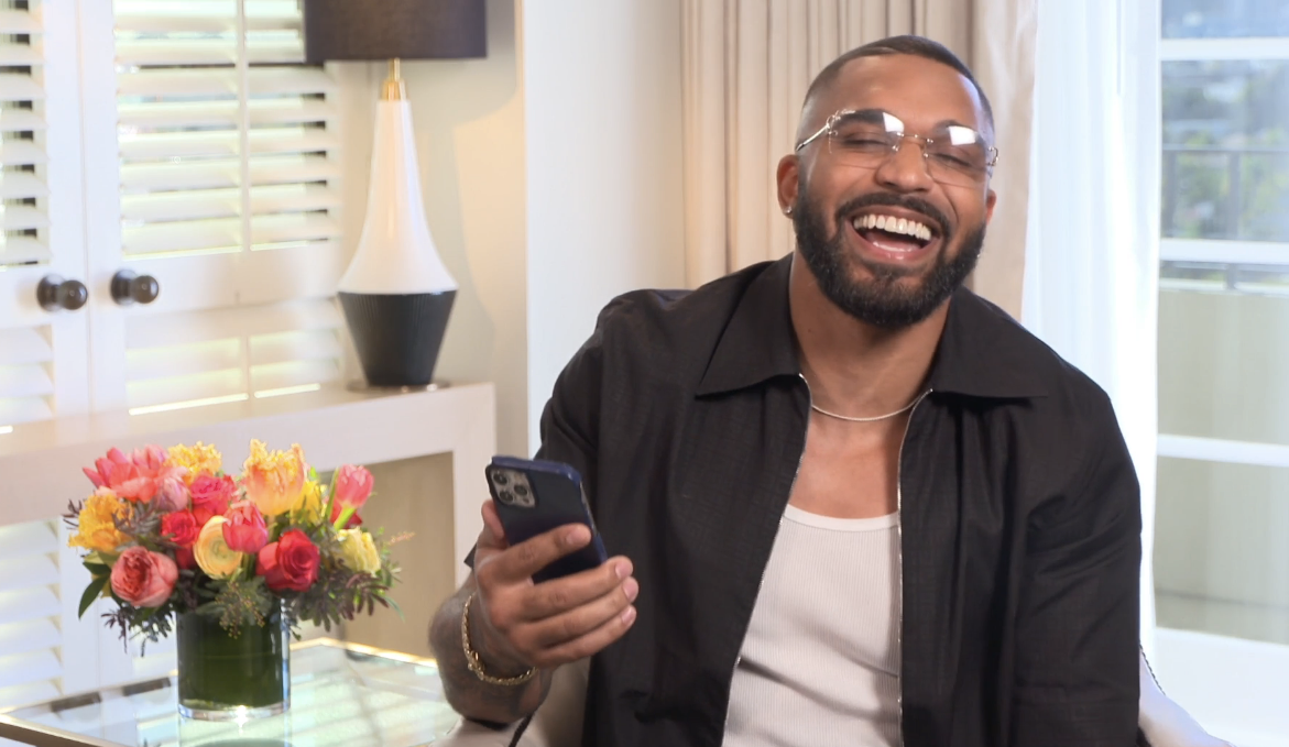 Tyler Lepley laughing while reading Thirst Tweets