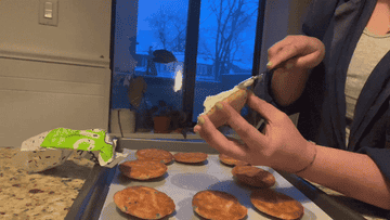 author assembling a cookie sandwich