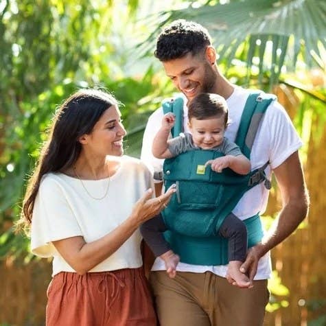 Family with child in baby carrier
