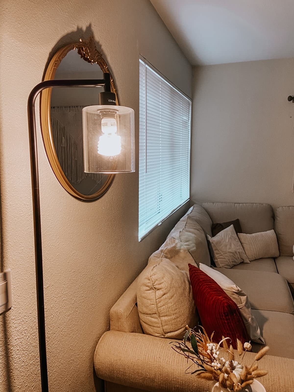 Industrial pendant floor lamp next to couch