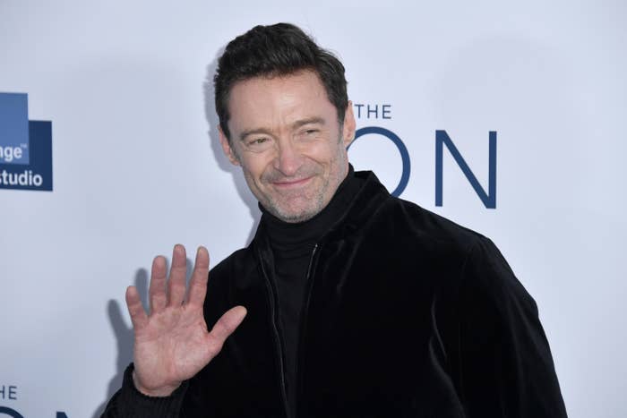 hugh waving at fans