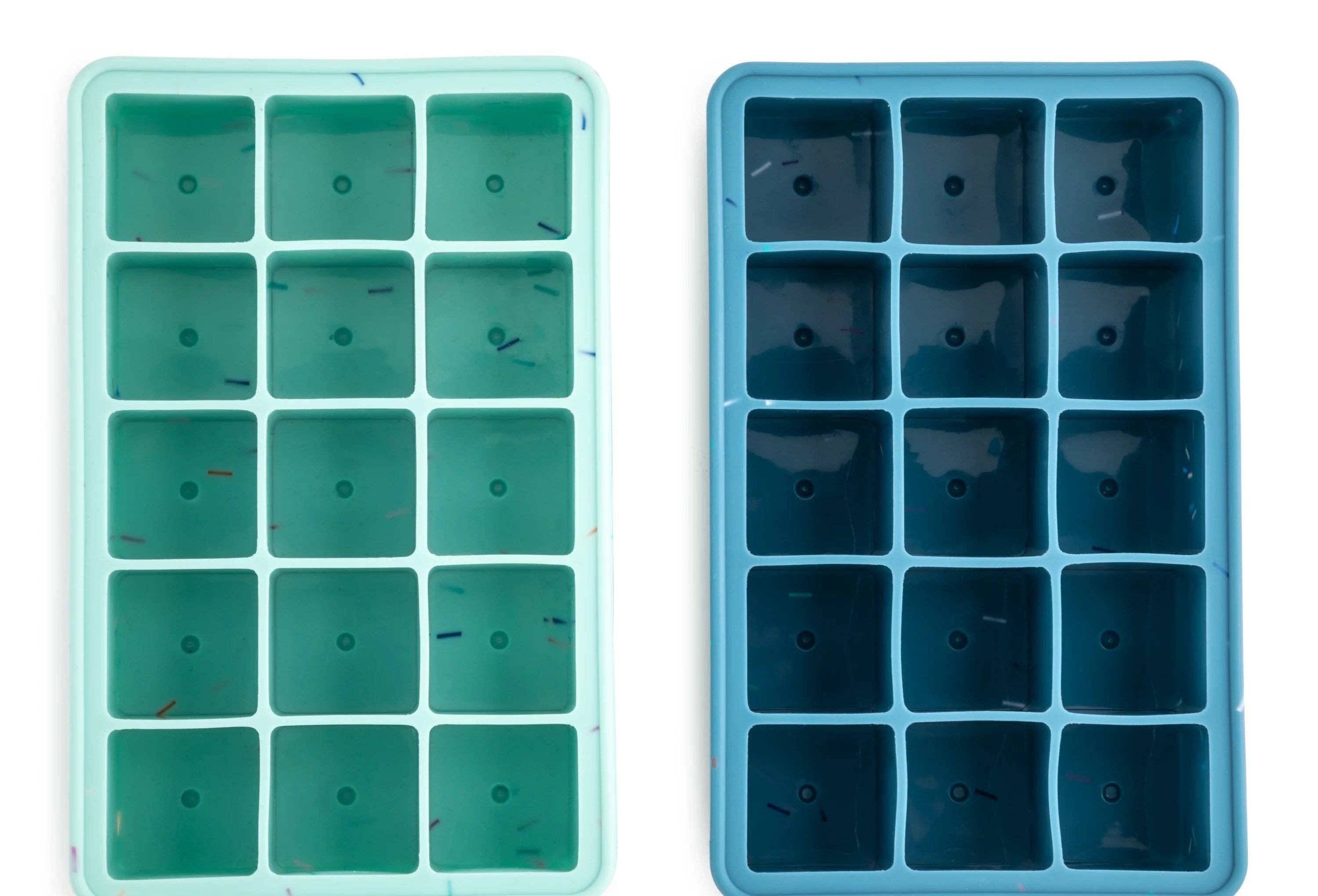 a set of green and blue ice trays