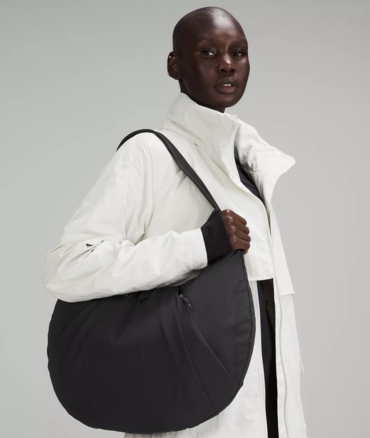 A person wearing the bag over their shoulder