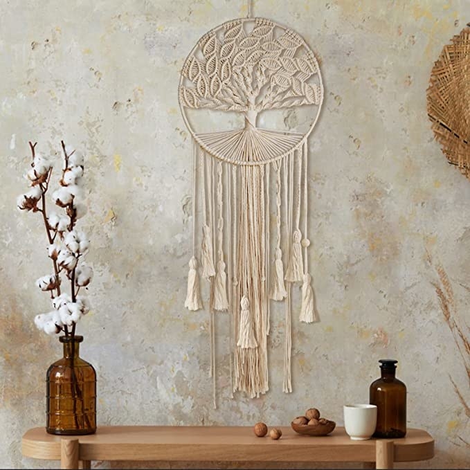 Dream catcher hanging on the wall next to home decor