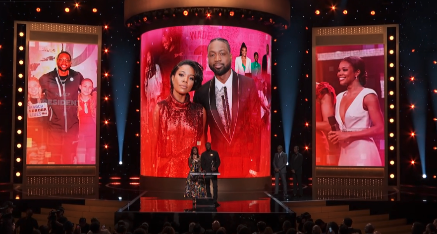 Gabrielle Union and Dwyane Wade accepting an award