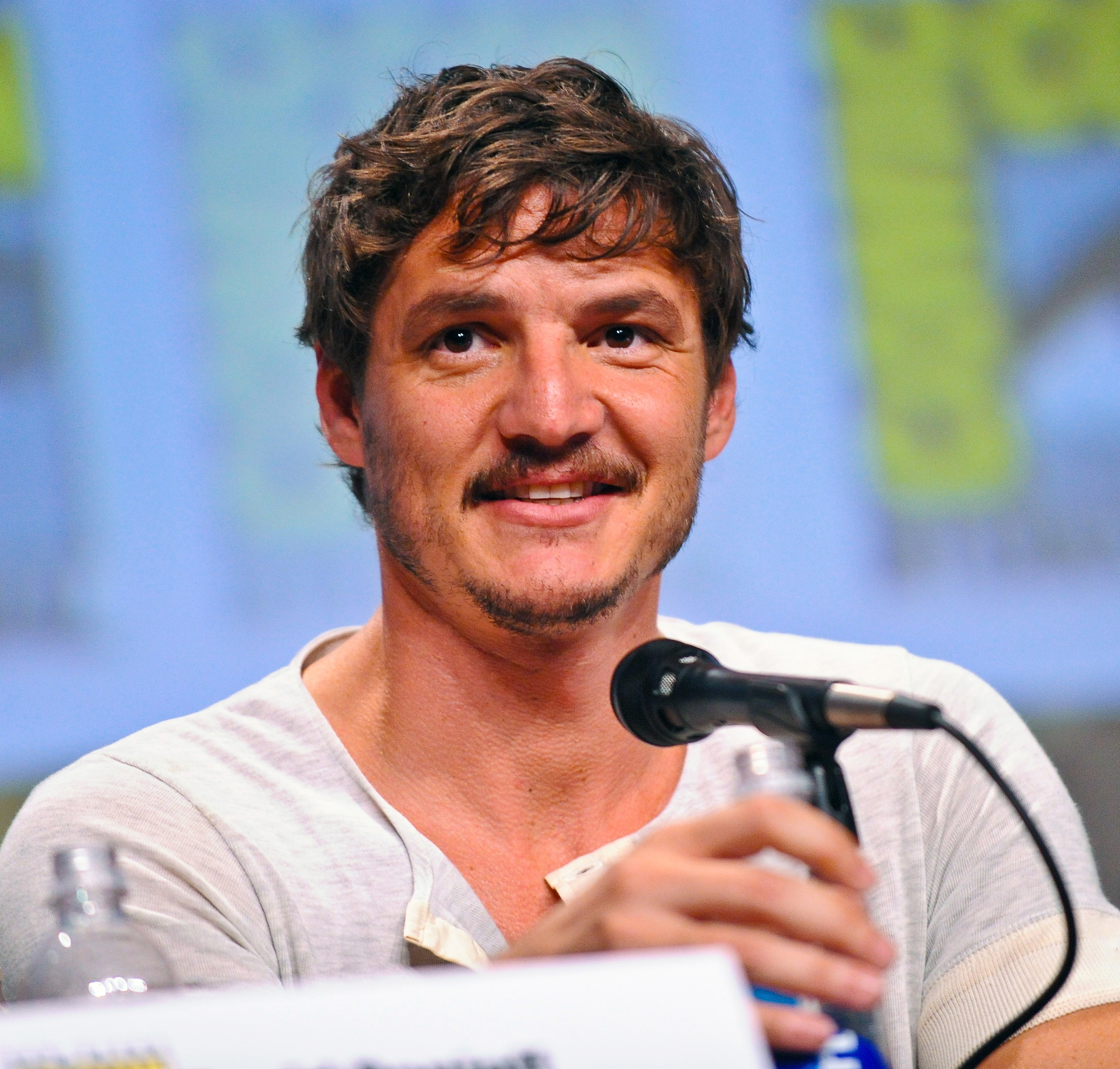 Close-up of Pedro sitting in front of a microphone