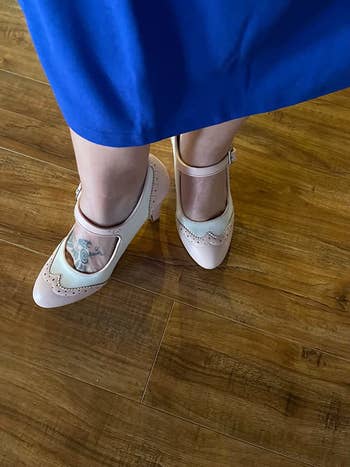 Reviewer wearing the pink and ivory heels