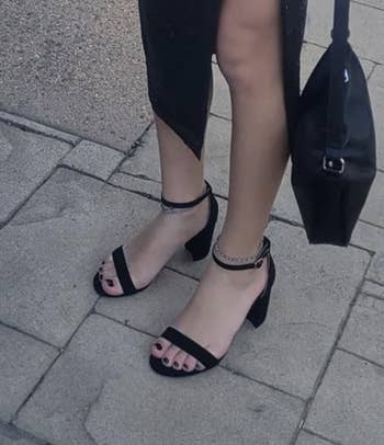 Reviewer wearing the black heels