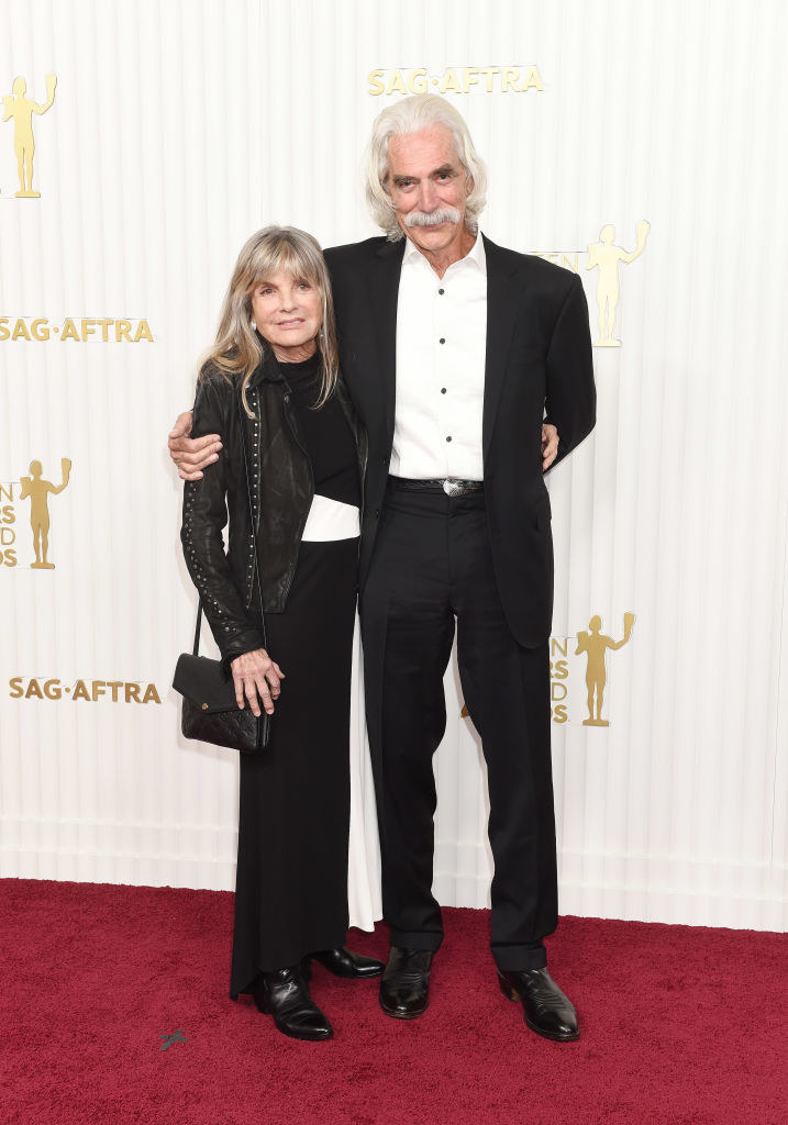 Katharine Ross and Sam Elliott smiling and arm in arm on the red carpet at the 29th Annual Screen Actors Guild Awards