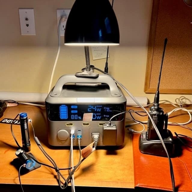 Reviewer&#x27;s station charging up multitude of devices reading 88% charge left and 24W of power