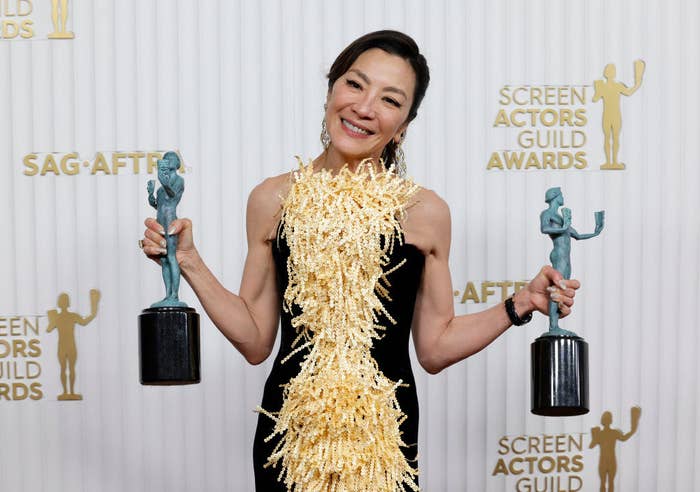 Michelle holding her two SAG awards