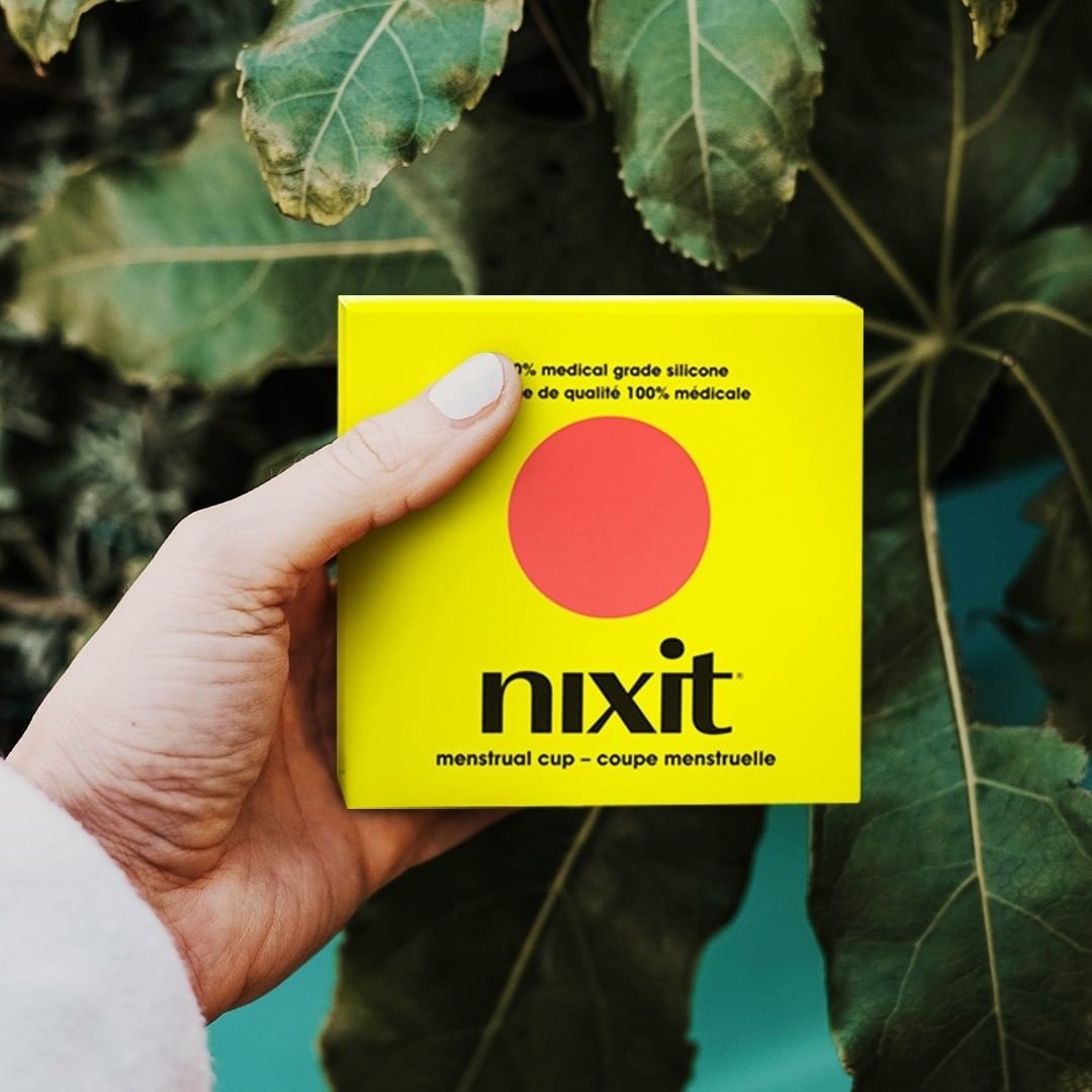 A person holding up a nixit box