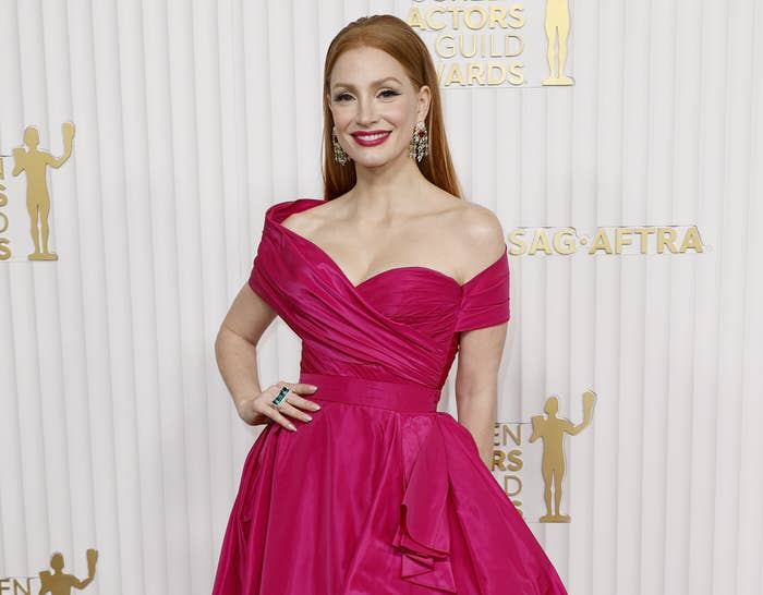 A close-up of Jessica on the red carpet in an off-the-shoulder gown