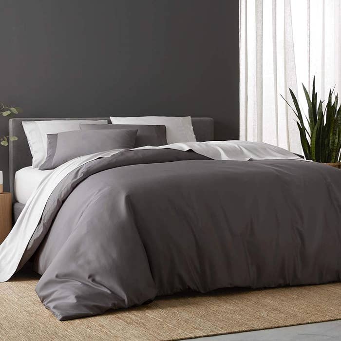 bed dressed with slate colored sijo sheets and duvet cover