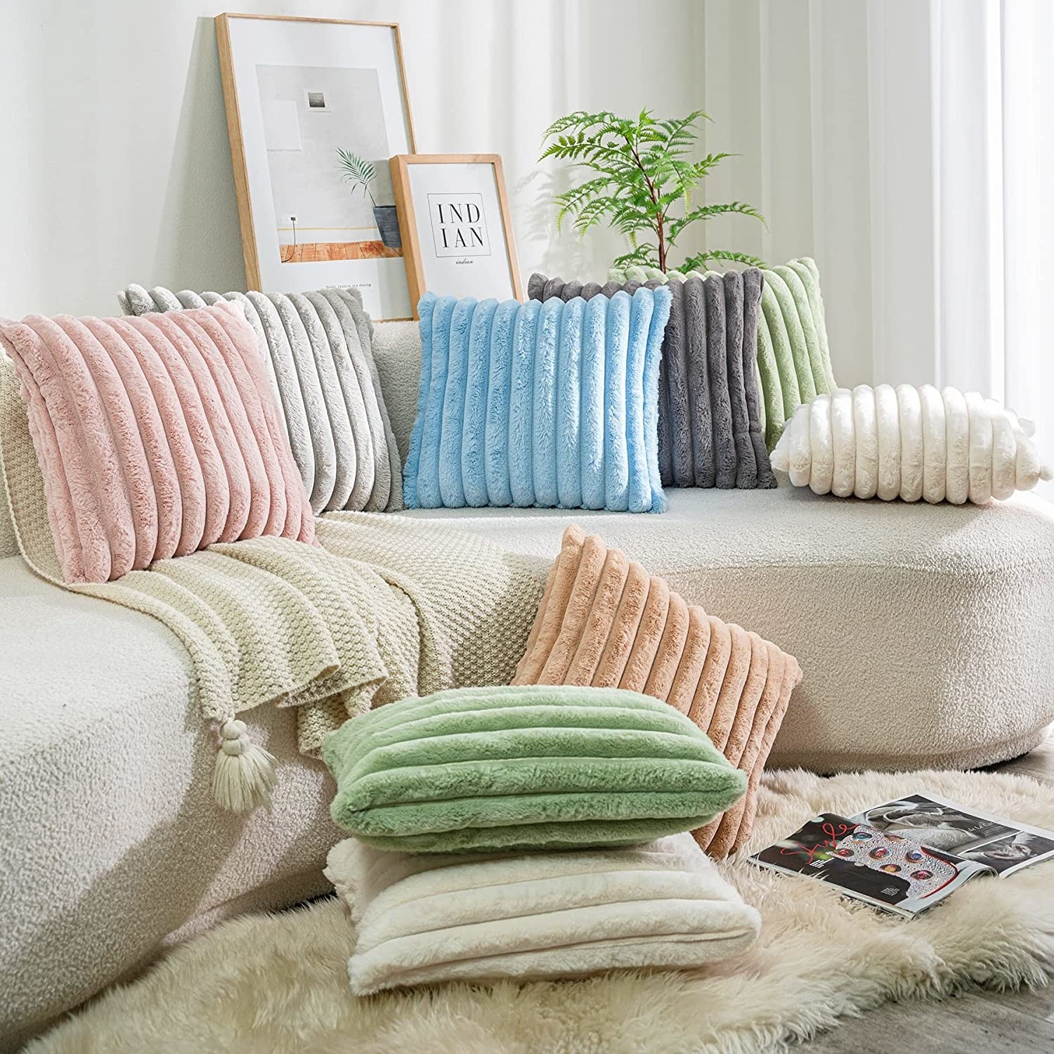 an assortment of fuzzy faux fur pillows scattered around a living room