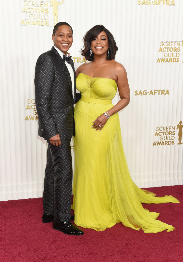 Jessica Betts and Niecy Nash-Betts smiling and arm in arm on the red carpet at the 29th Annual Screen Actors Guild Awards