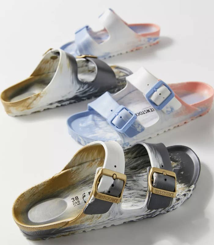 a few pairs of the sandals on a plain background