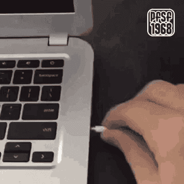A person&#x27;s headphone cord snagging and dropping their computer