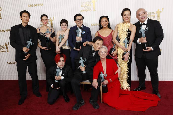 The film&#x27;s cast smile for a group photo with their awards