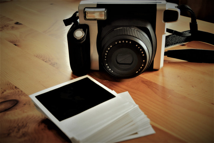 A camera and polaroids