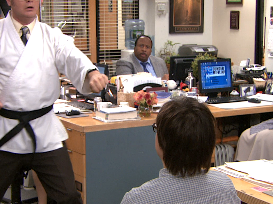 character wearing a black belt with punching in the office
