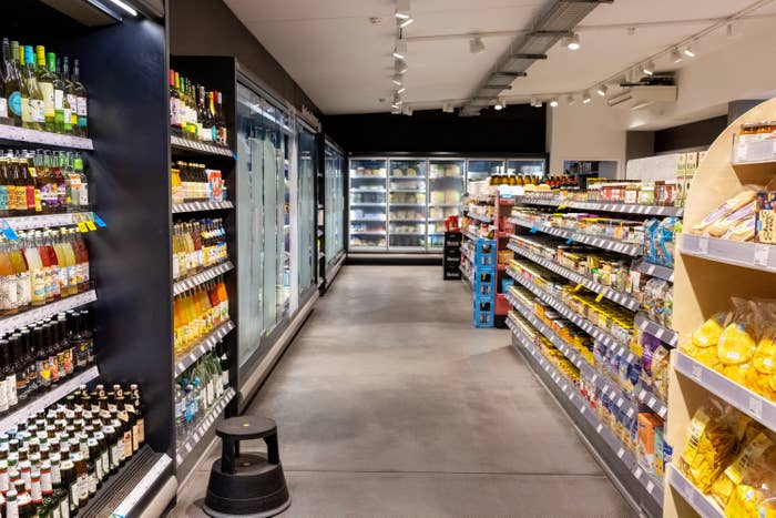 Interior of a supermarket with products displayed on the racks, grocery section in a supermarket