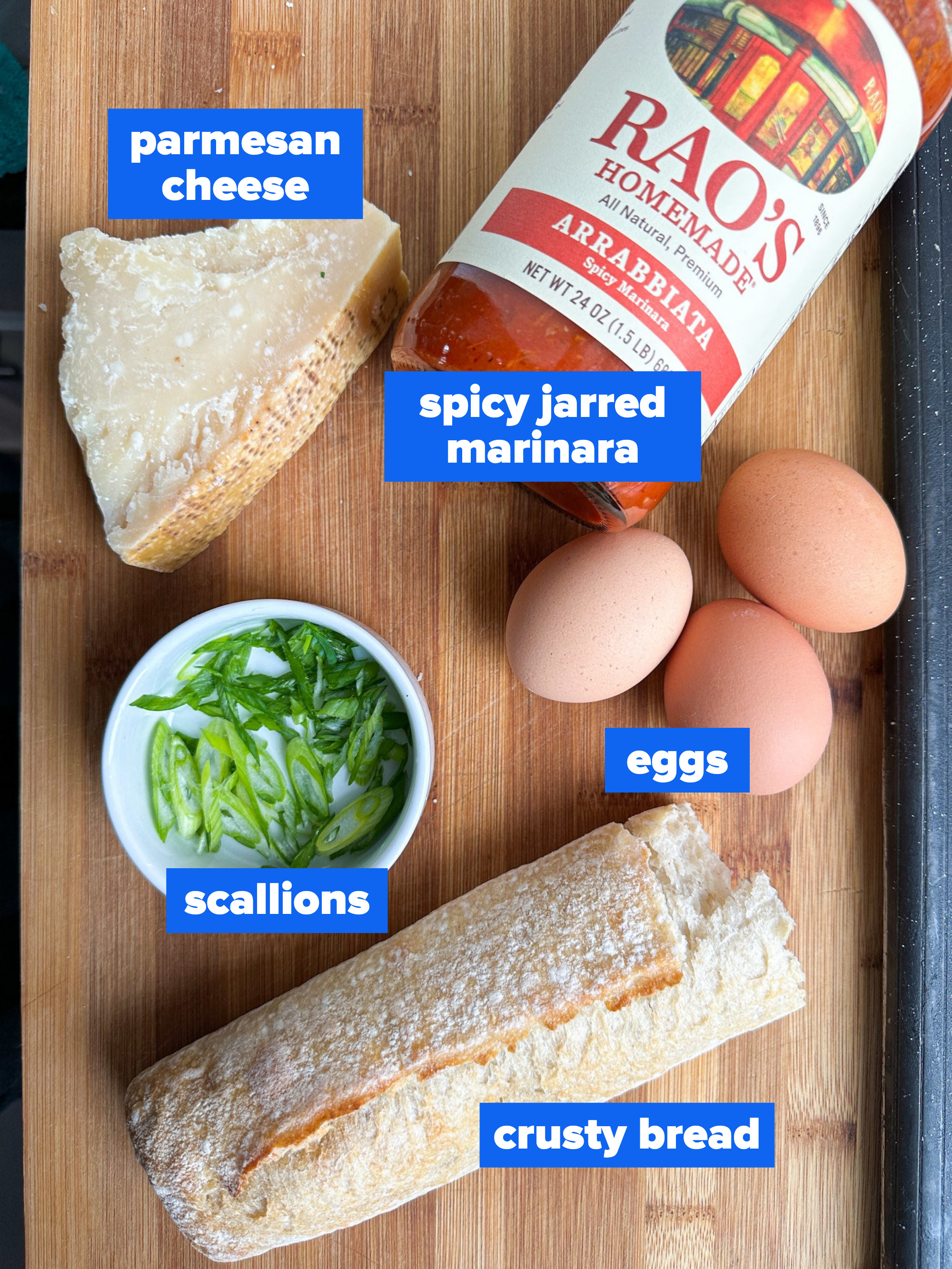 the ingredients: parmesan cheese, spicy jarred marinara, eggs, scallions, crusty bread