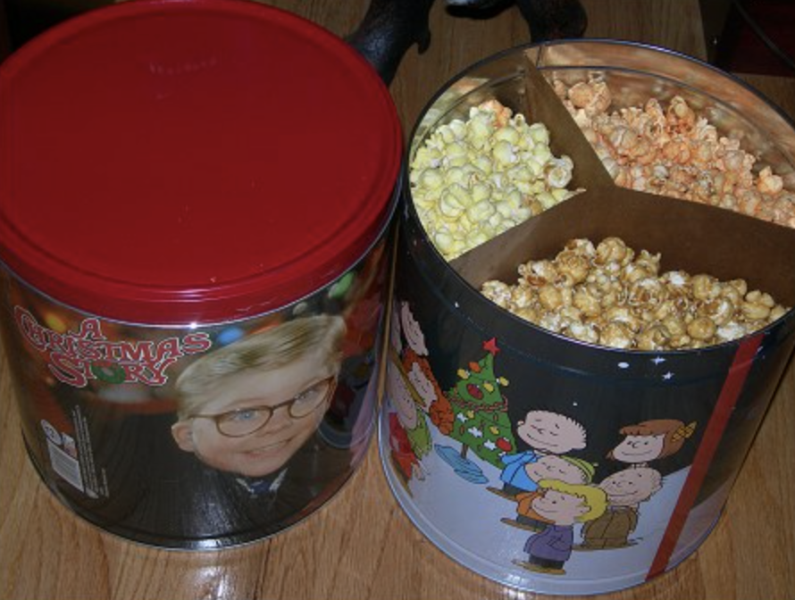 tin filled with three different popcorn flavors