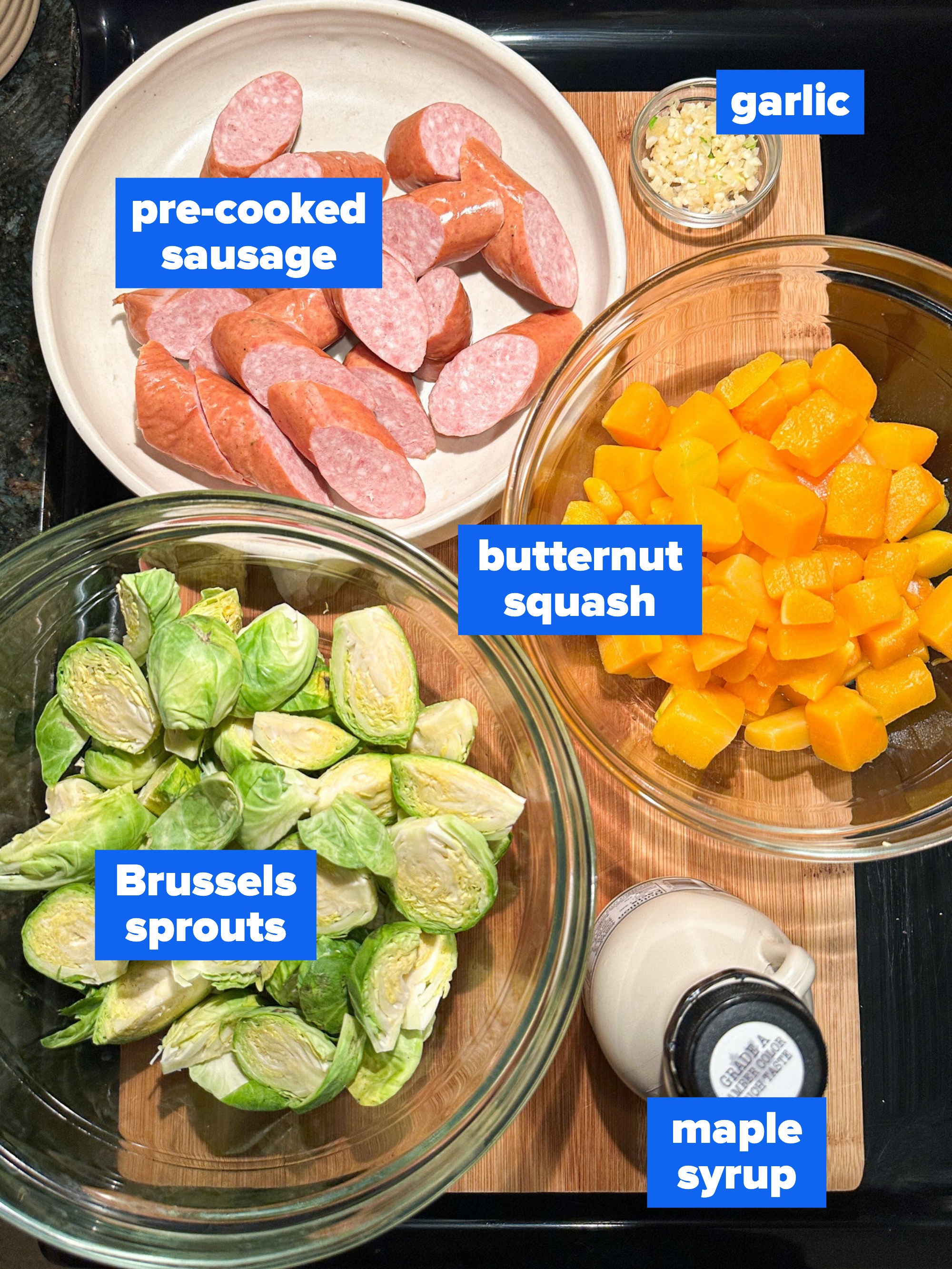 the ingredients: pre cooked sausage, garlic, butternut squash, Brussels sprouts, maple syrup
