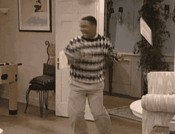 gif of Carlton from &quot;Fresh Prince Of Bel-Air&quot; doing a dance in the living room