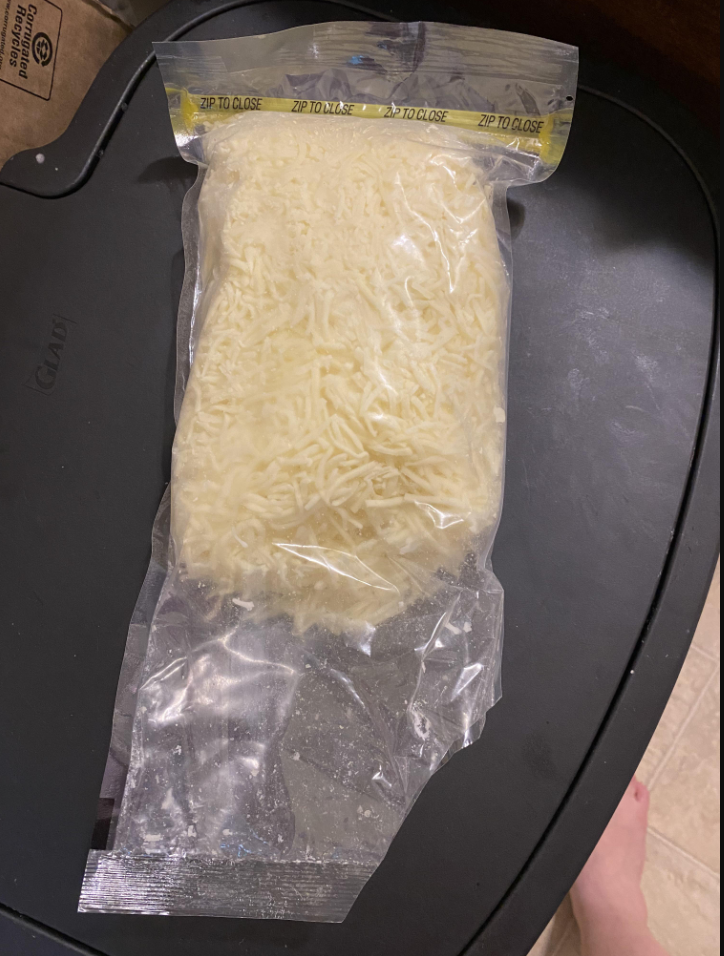 A badly-opened bag of cheese