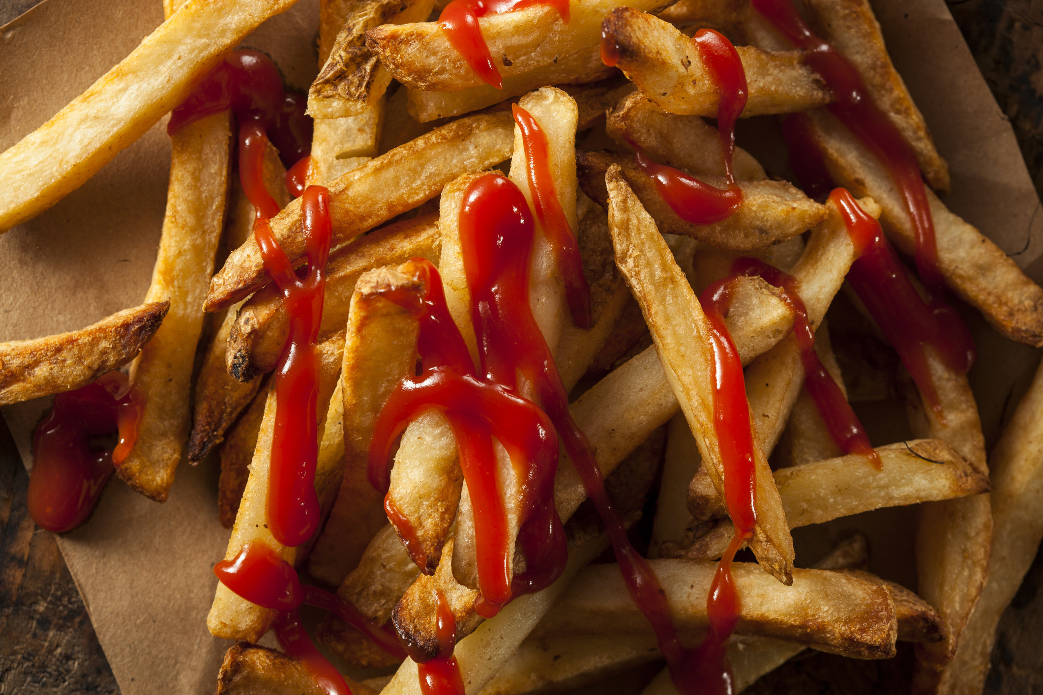 French fries topped with ketchup.