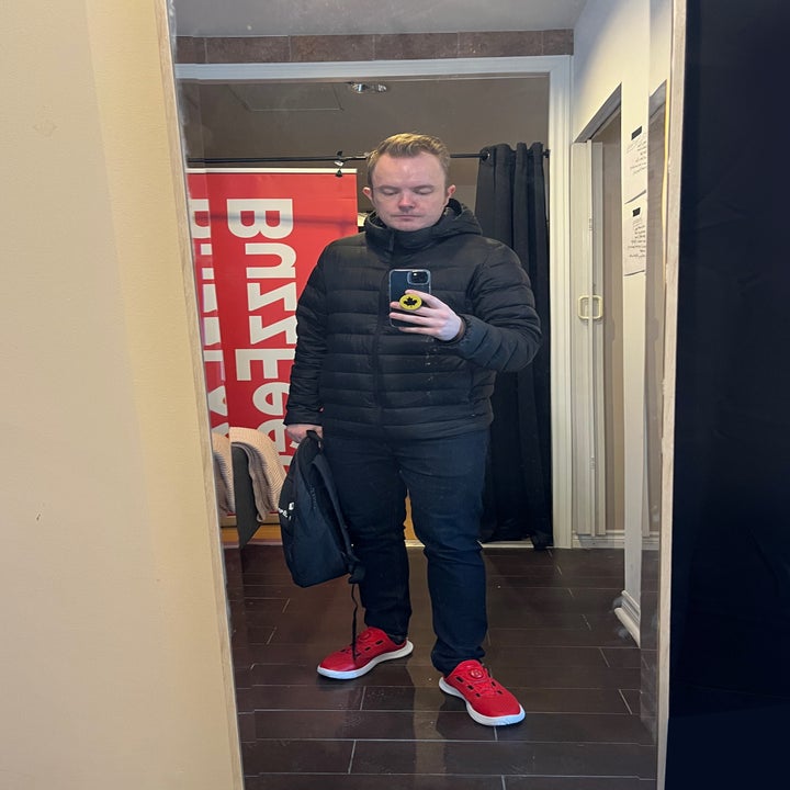 the author taking a photo in a mirror