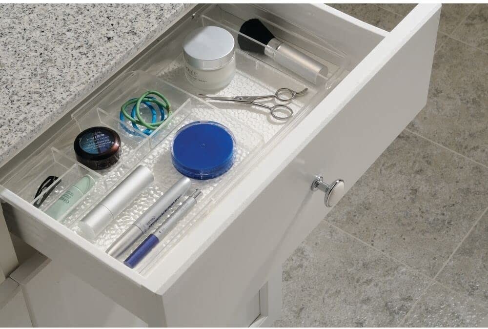 clear tray in a drawer, expanded to fit to either edge