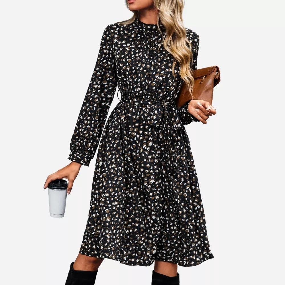 The dress being worn while holding coffee and a purse