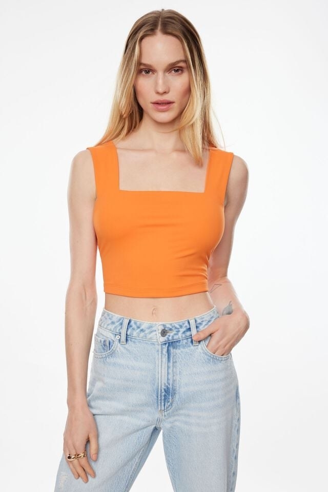 model wearing the top with jeans