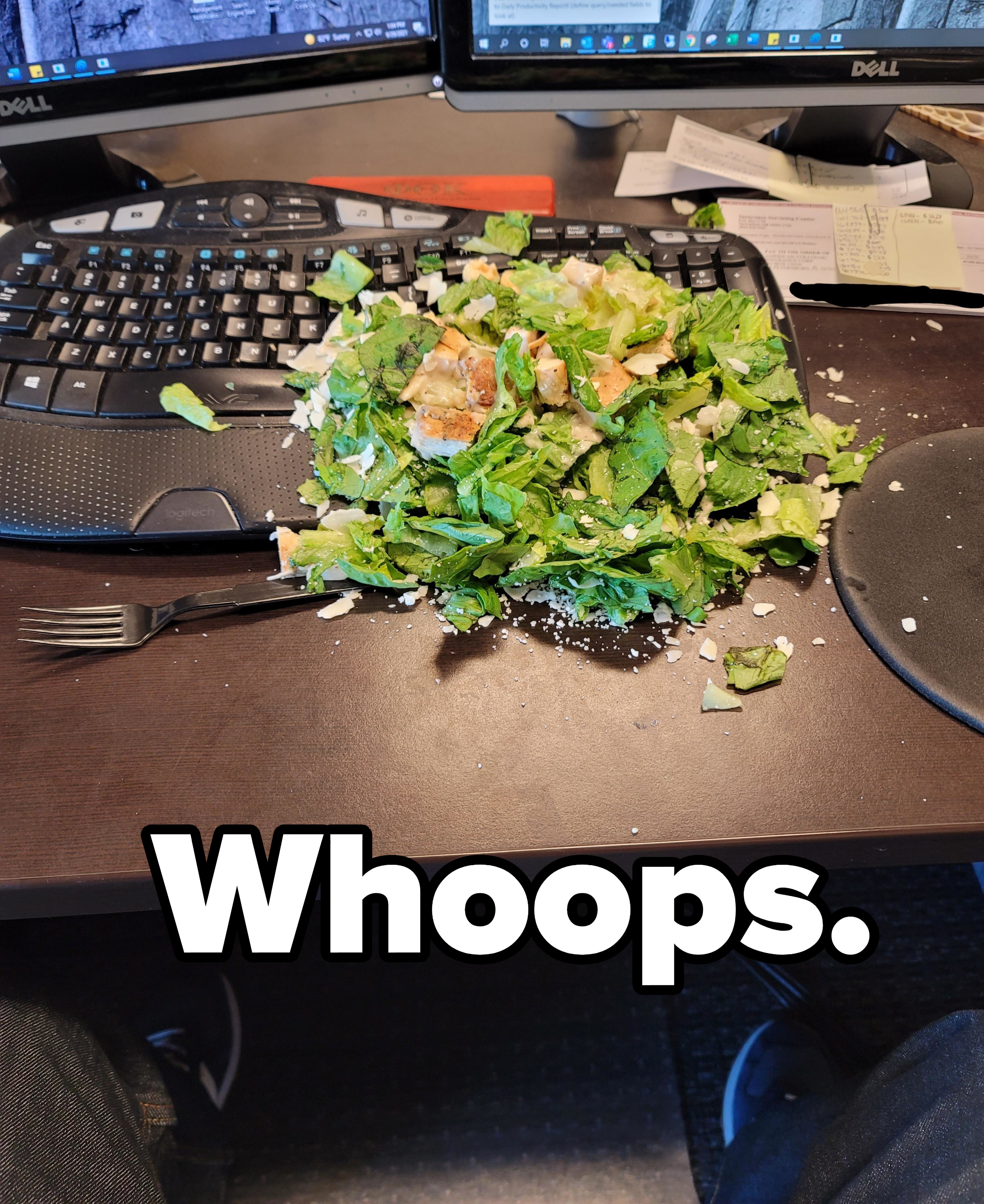 salad spilled over a computer keyboard