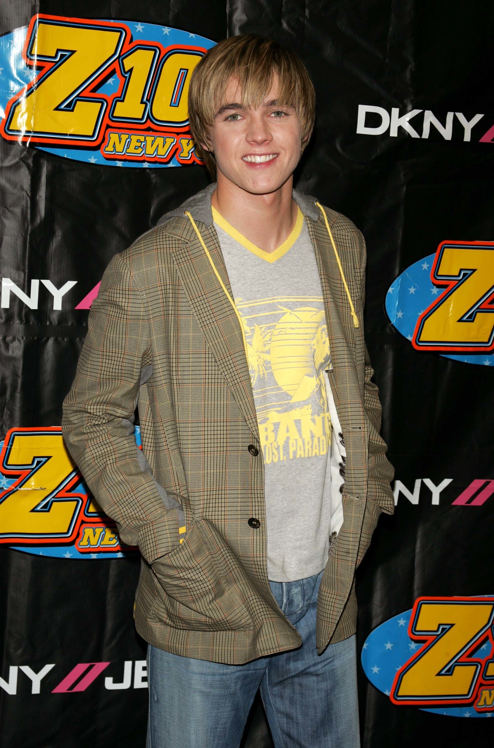 jesse wearing a blazer and jeans at an event