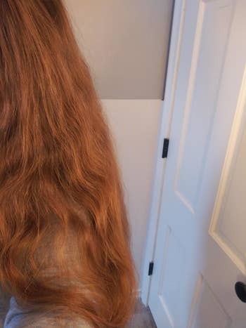 Reviewer with frizzy long red hair