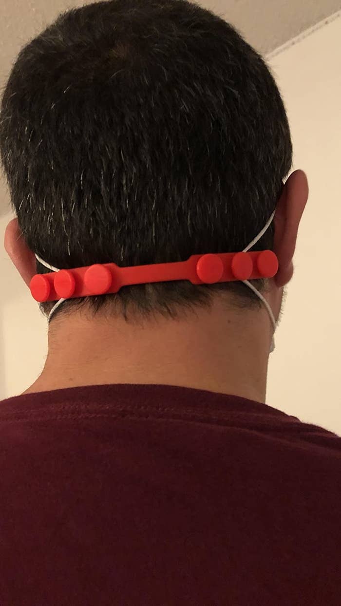 A reviewer wearing the extender