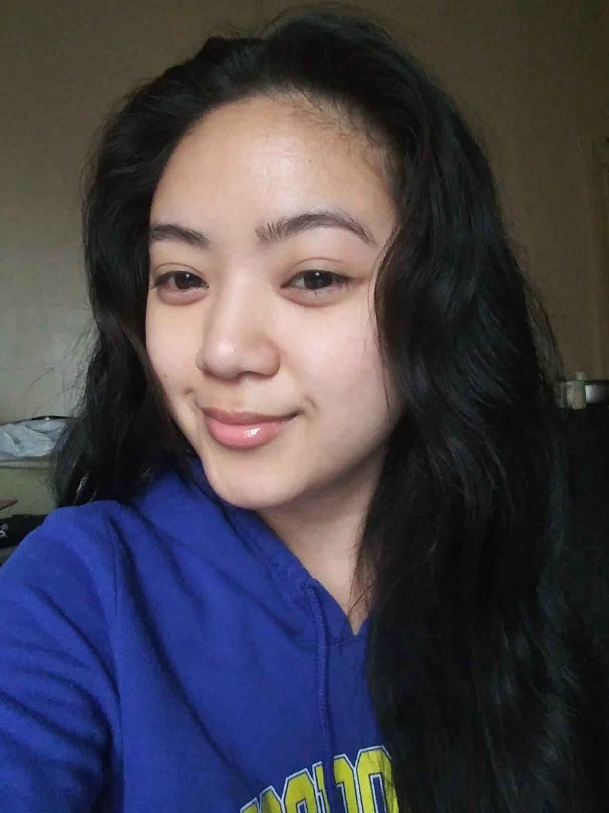 reviewer showing off their glowing, hydrated skin