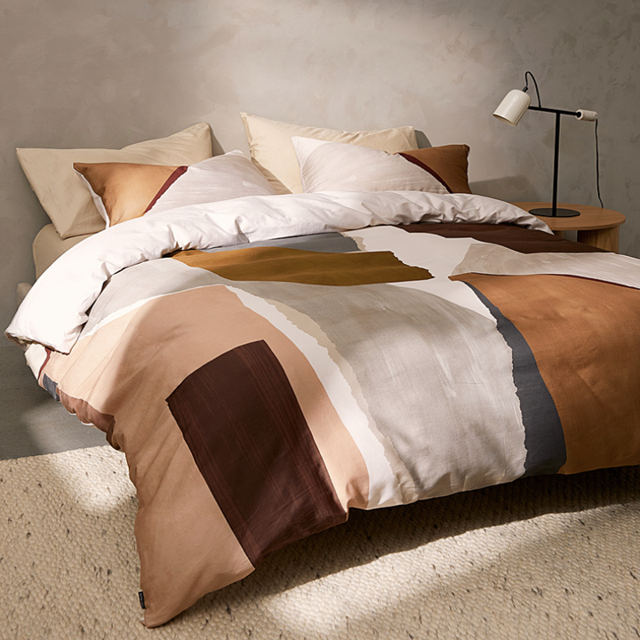 the duvet on a bed in a bedroom