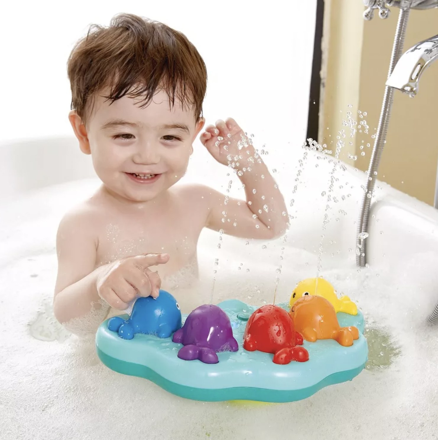 child playing with the bath toy