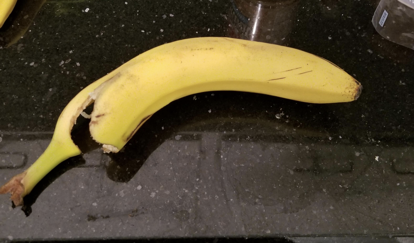 opened banana on the counter