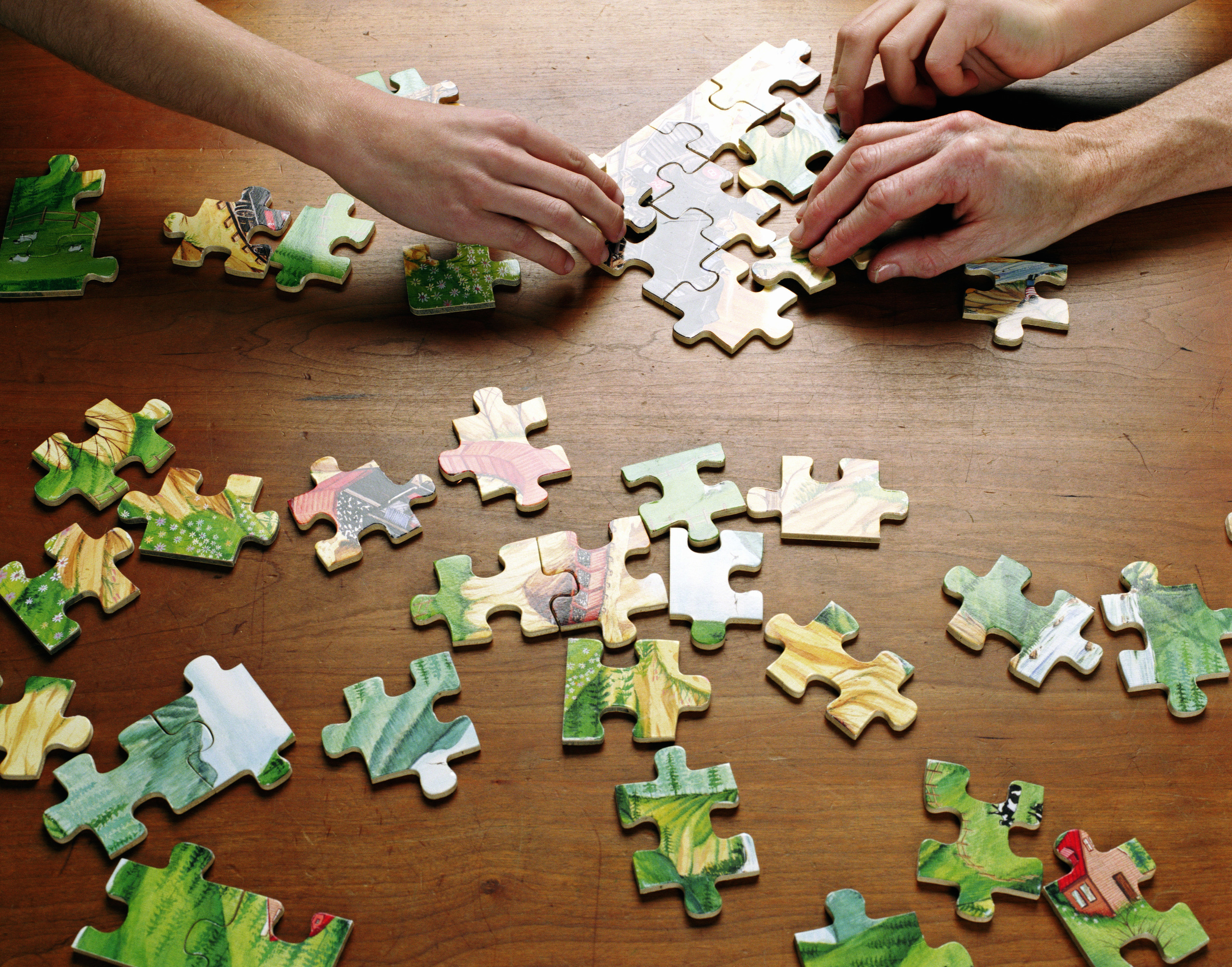 people working on a puzzle
