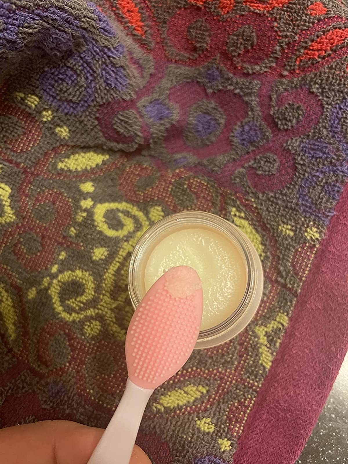 a bit of the lip scrub on an exfoliating brush