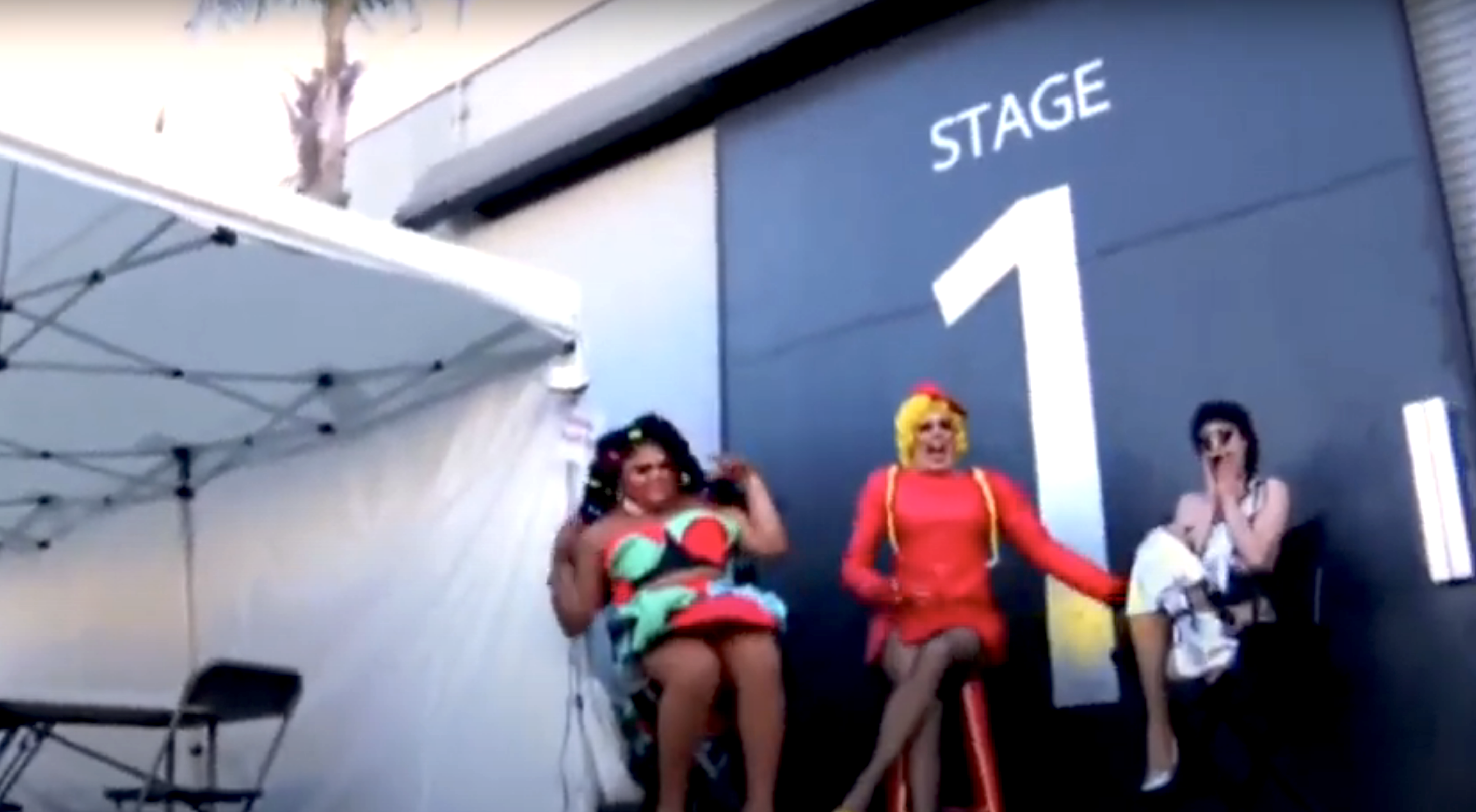 queens standing near stage 1